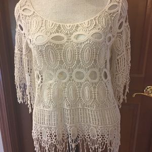 Cream lace coverlet.